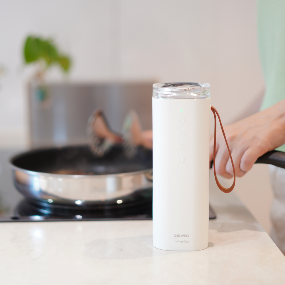 Baby Safe Air Doctor on kitchen counter with person cooking on stovetop in background