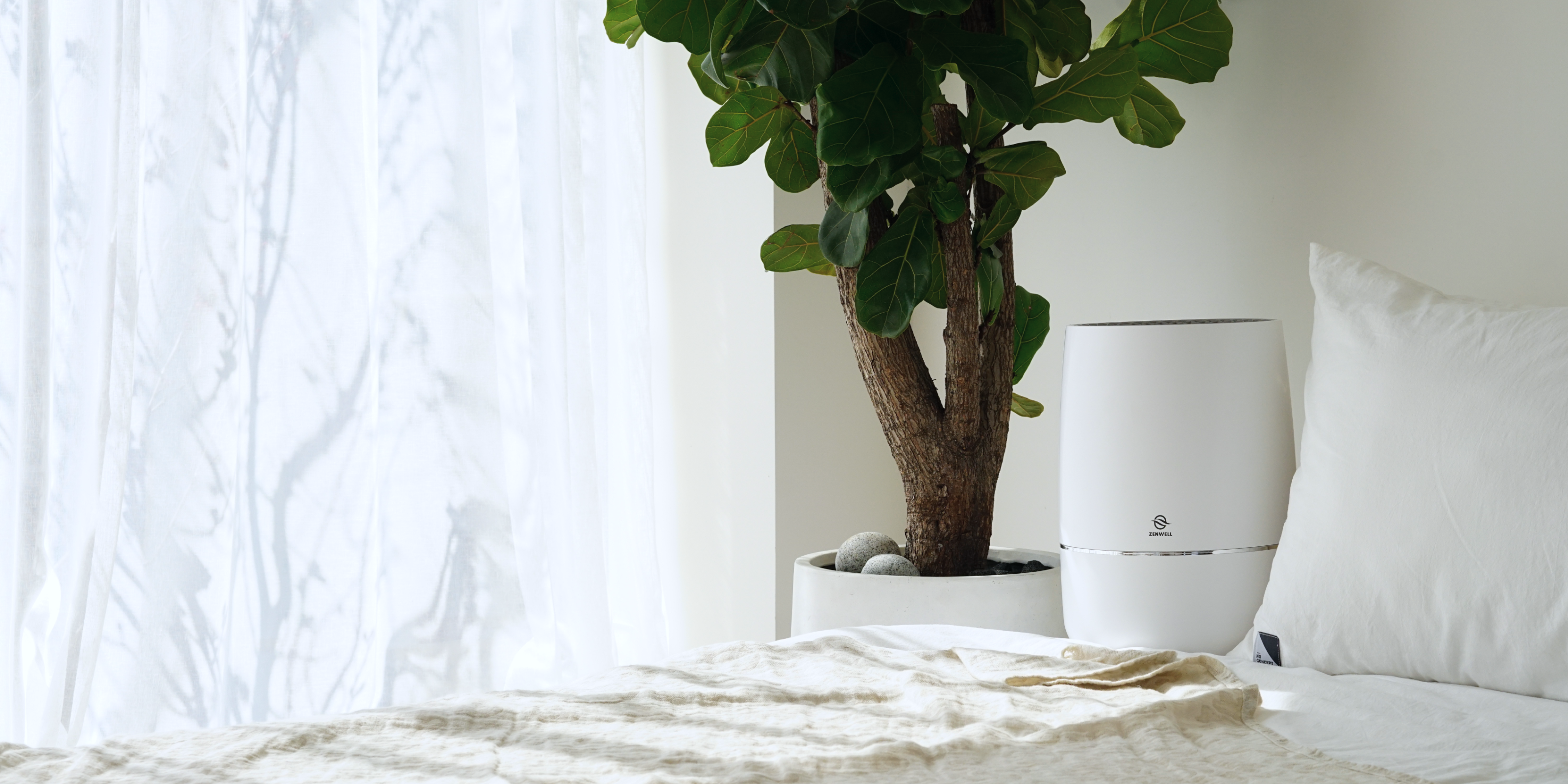 Zenwell Humidifier + Purifier placed in clean bedroom