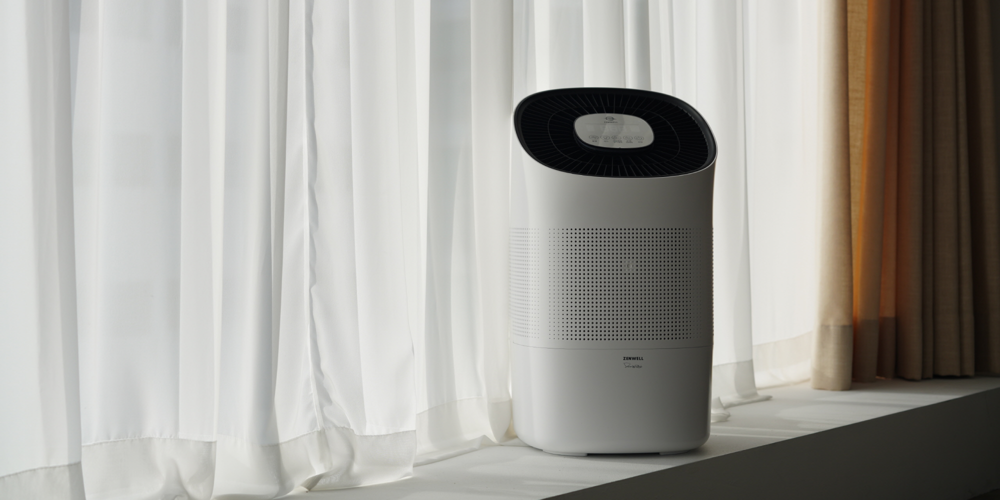 Zenwell Super Air Purifier + Humidifier on window sill in front of white curtain