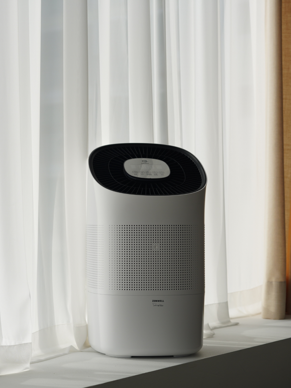 Zenwell Super Air Purifier + Humidifier on window sill in front of white curtain