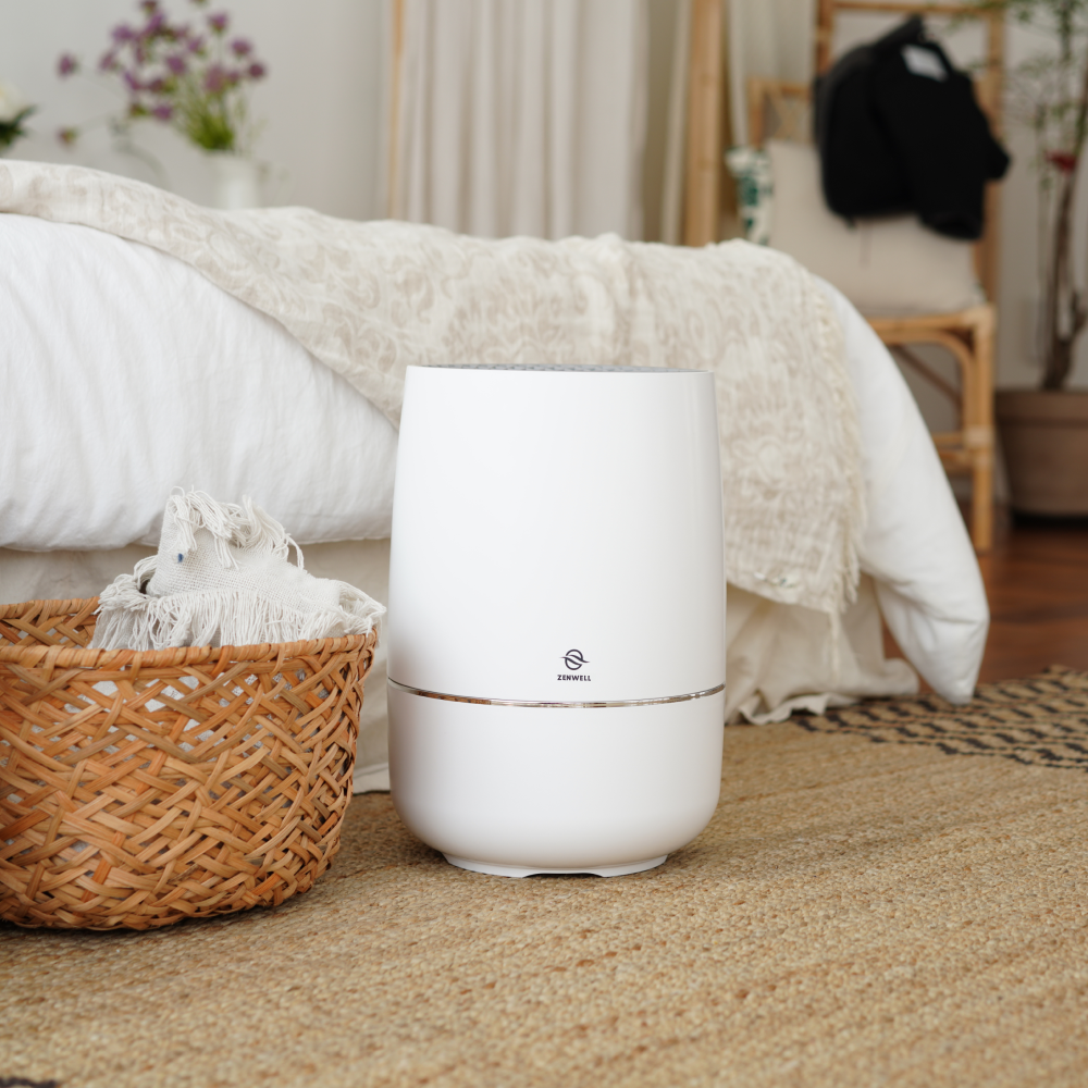 Zenwell Humidifier + Purifier on bedroom floor next to bed and basket