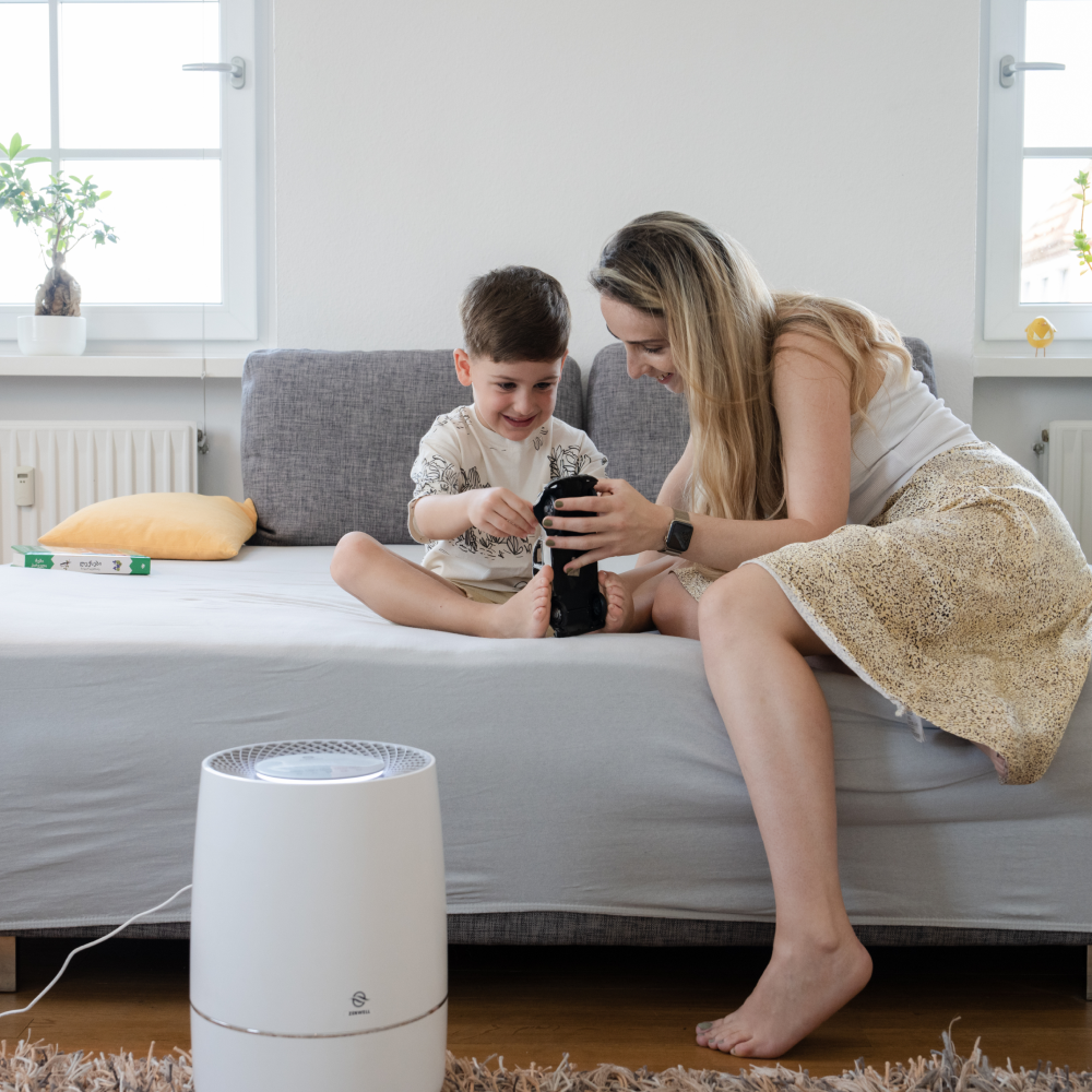 Zenwell Air Purifier and Humidifier on bedroom floor with mom and toddler playing in background