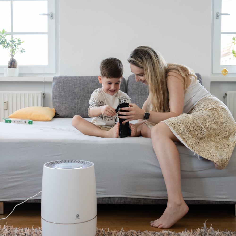 Zenwell Humidifier on bedroom floor with mom and toddler playing in background