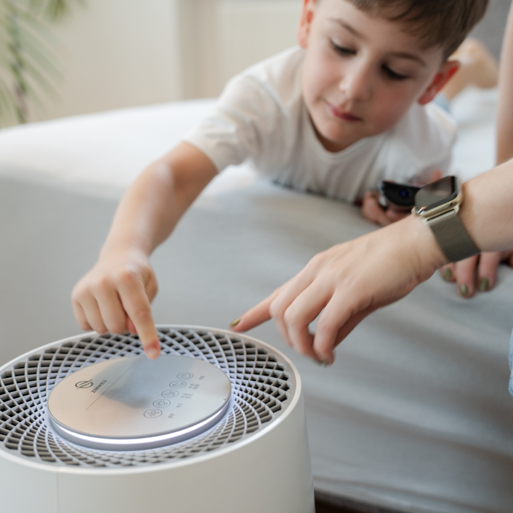Zenwell Air Purifier and Humidifier display closeup with toddler and parent pressing buttons