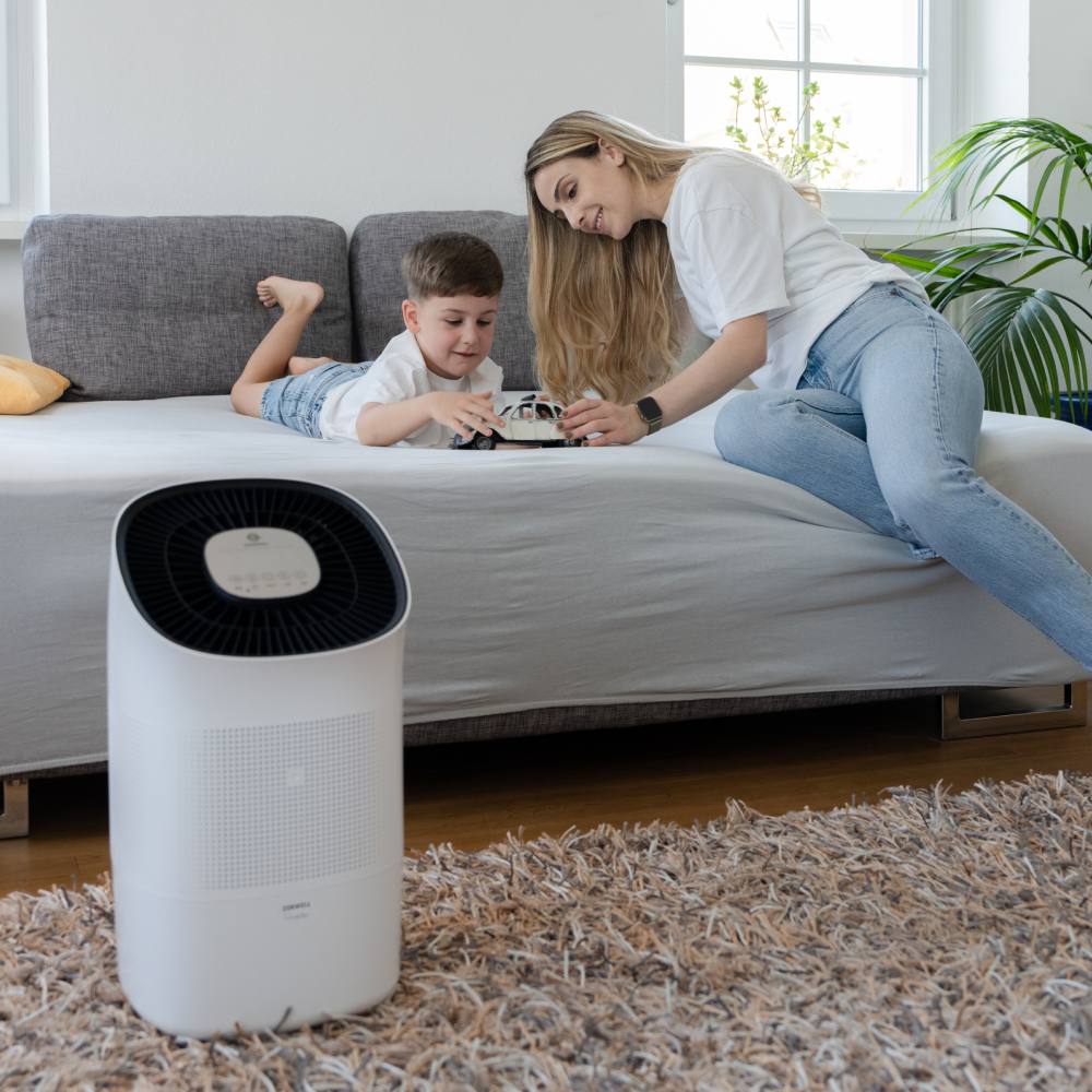 Super Air Purifier and Humidifier on bedroom floor with mother and toddler playing in background
