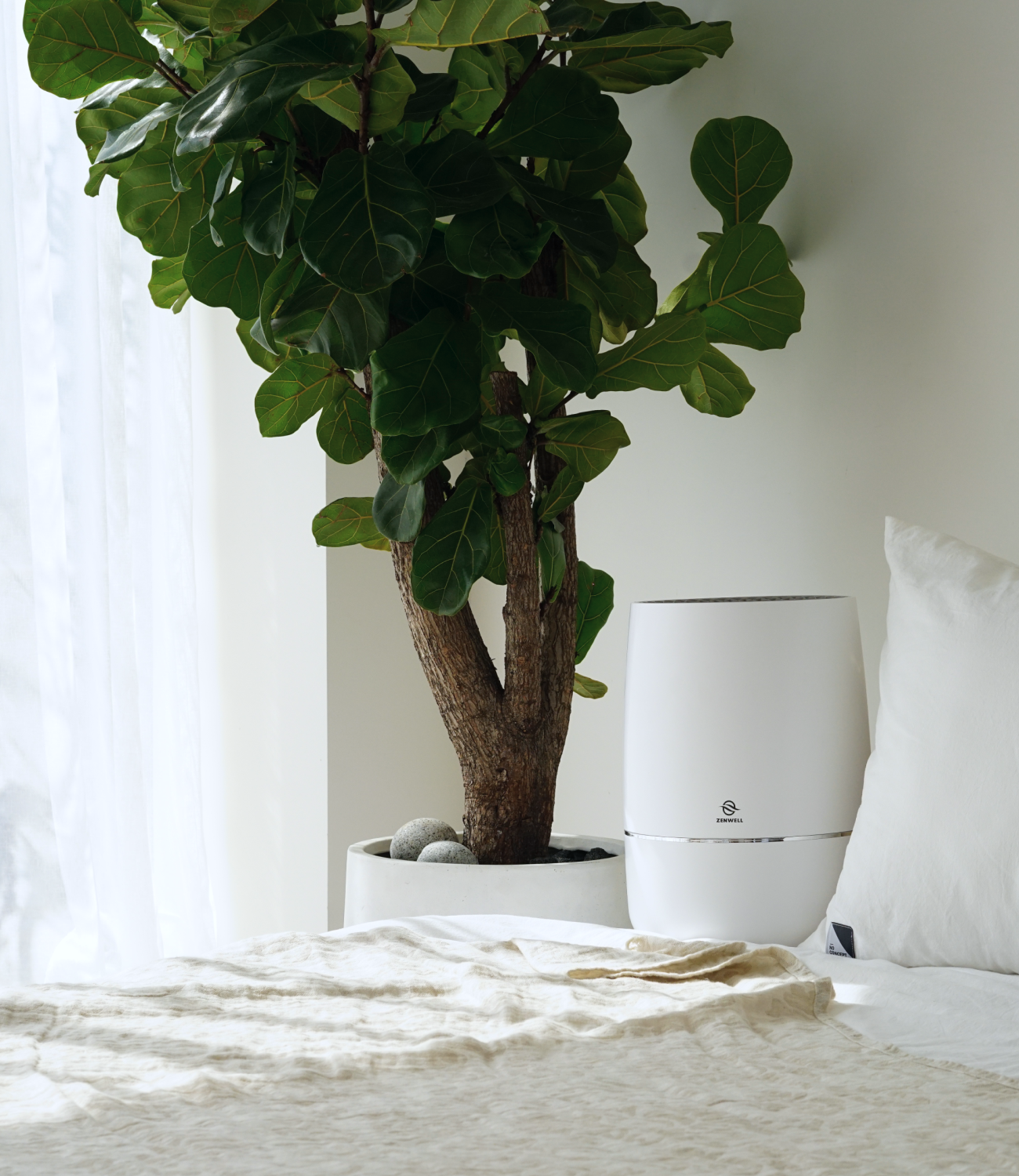 Zenwell Humidifier + Purifier placed in clean bedroom 
