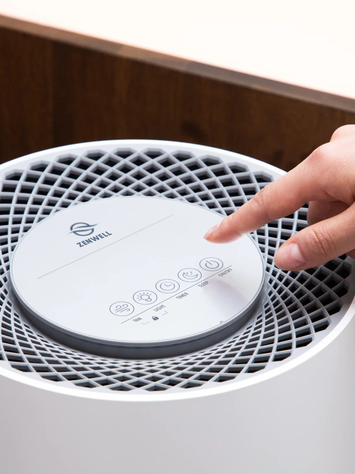 Hand turning on Zenwell appliance with its touch display