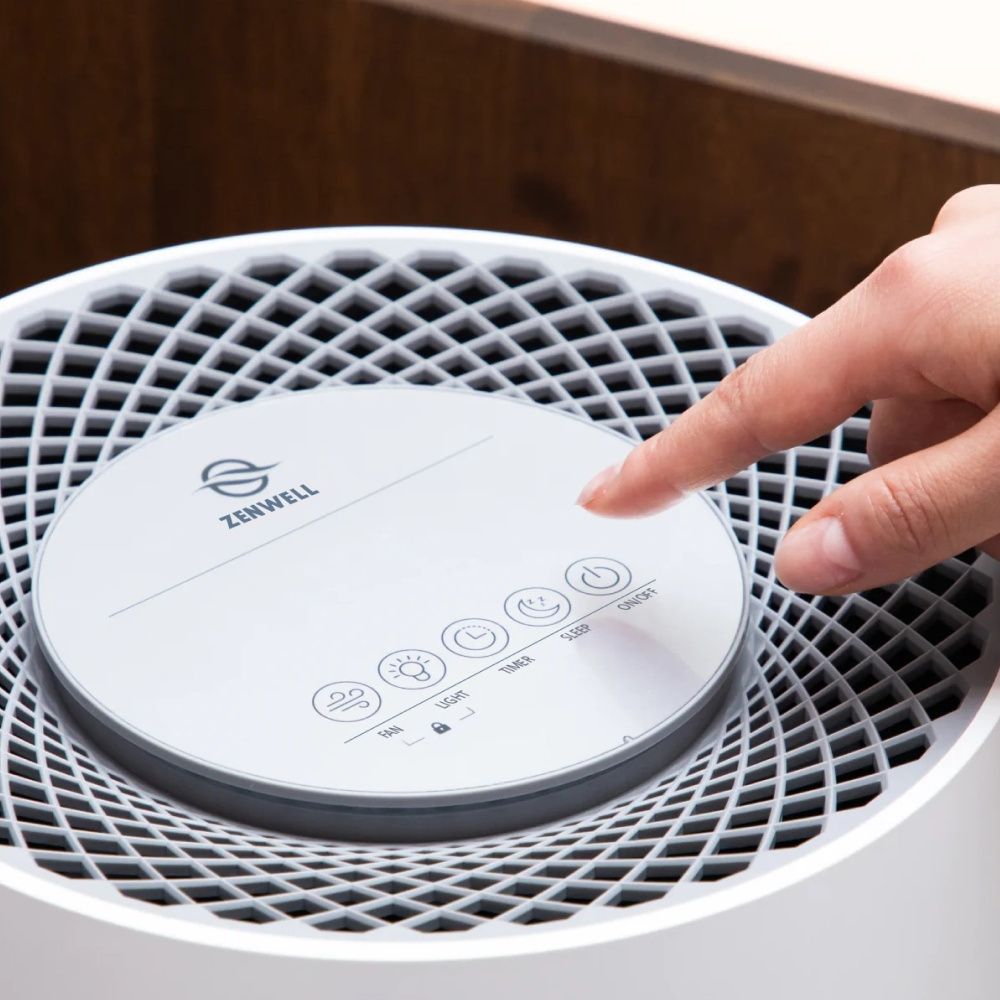 Hand turning on Zenwell Humidifier with its touch display