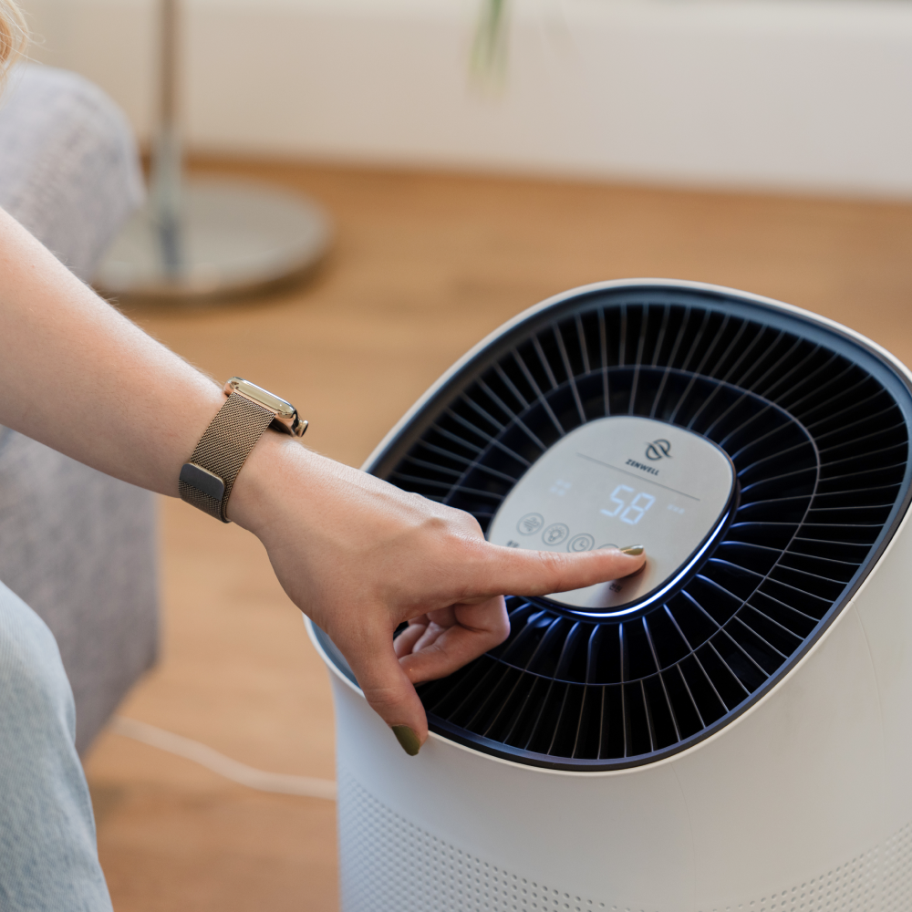 Hand interacting with Zenwell Super Air Purifier + Humidifier Smart touch display